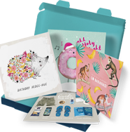 A Wuzci Friends & Family subscription box, showing four greeting cards popping out.