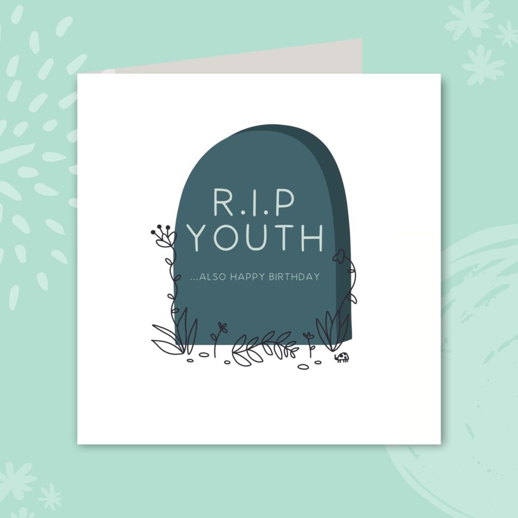 Image of a greeting card with a cartoon tombstone in the center. The tombstone is a grey/blue colour with a few sprigs decorating around the edges. It reads 