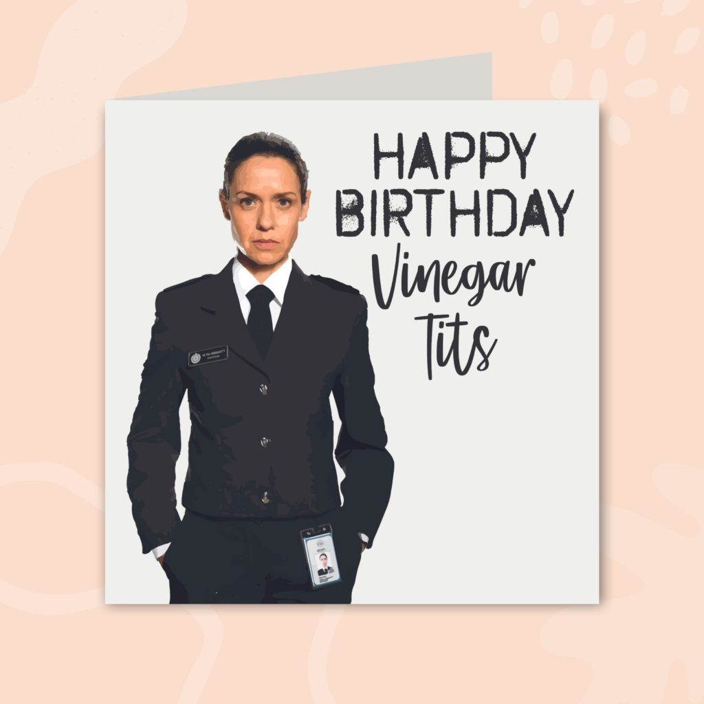 Image shows a white greeting card on a pale peach background. The card has an illustration of a character from the TV show, Prisoner: Cell Block H. On the right of the character, the card says 