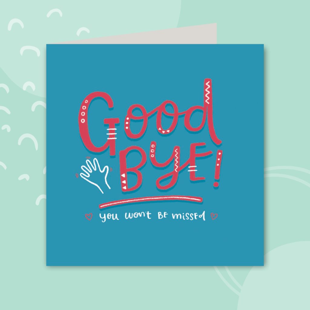 Image shows a blue greeting card on a pale mint background. The greeting card has red text in the middle and reads 